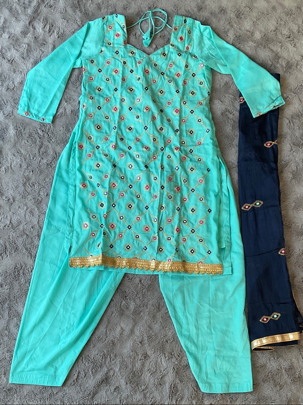 Woman’s Turquoise Embroidered Salwar Kameez with Navy Dupatta